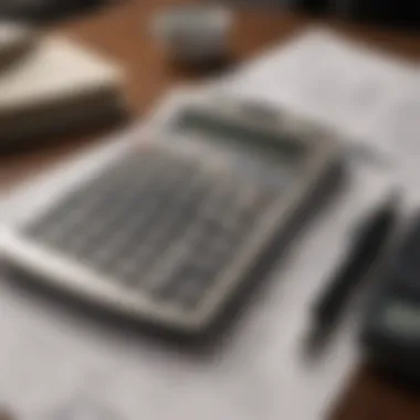 Close-up of financial documents with a calculator and pen