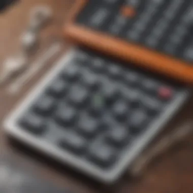 Close up of a financial calculator with house keys