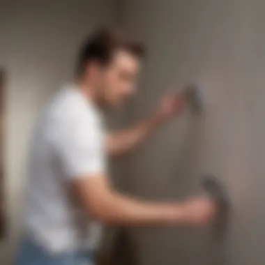 A painter applying a coat of paint to a wall